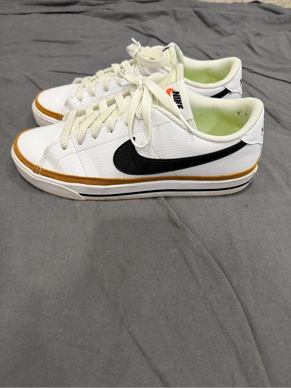 Nike White Sneakers with Black Swoosh and Tan Accent